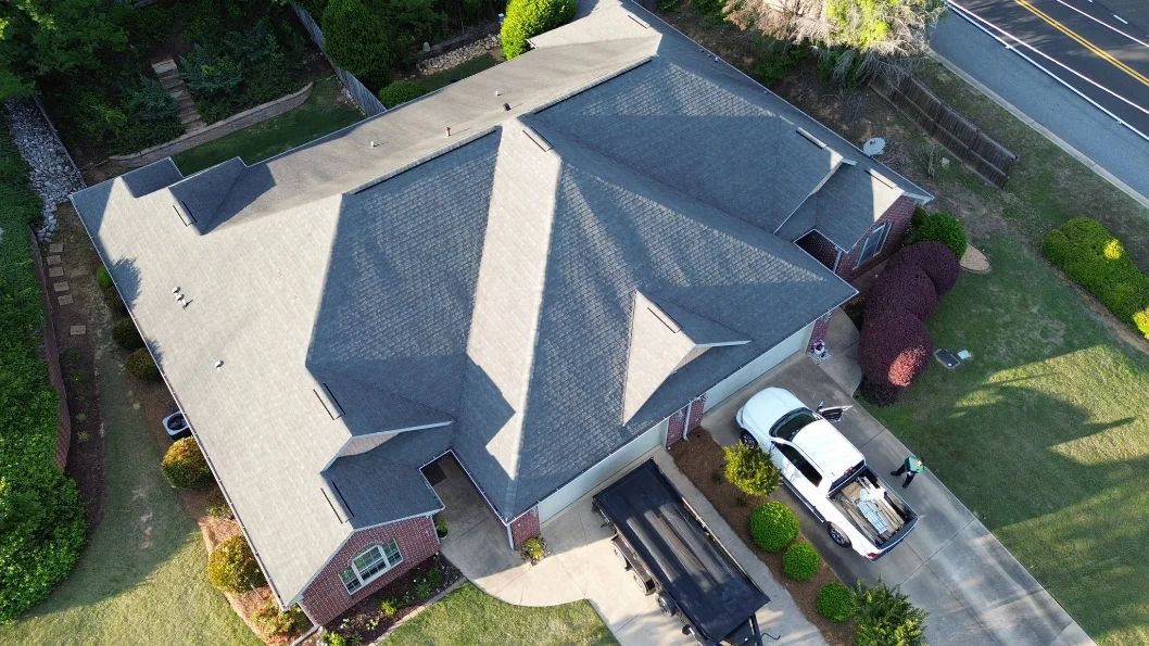Aerial view of a completed shingle roof replacement in Alabama