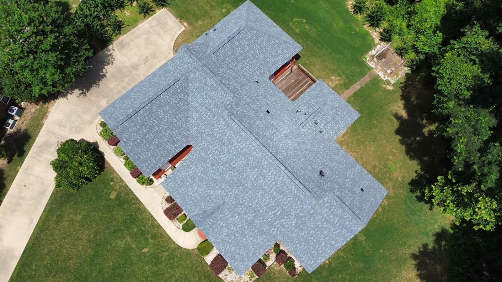 Drone view of a large completed shingle roof replacement in Alabama